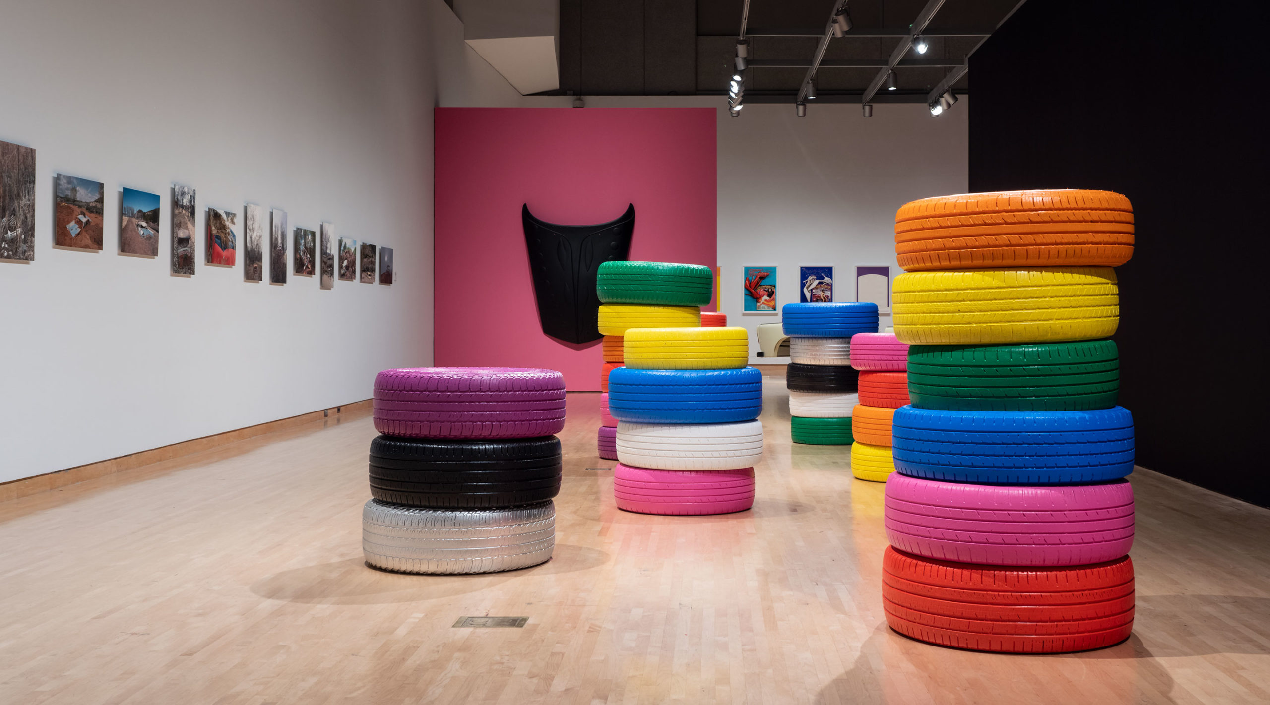 Justin Favela, Seven Magic Tires, 2022. Tires, paint, glue. Courtesy of the artist. Installation view of Desert Rider, 2022, Phoenix Art Museum.